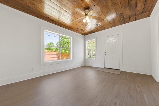 foyer entrance with baseboards, visible vents, wood ceiling, and wood finished floors
