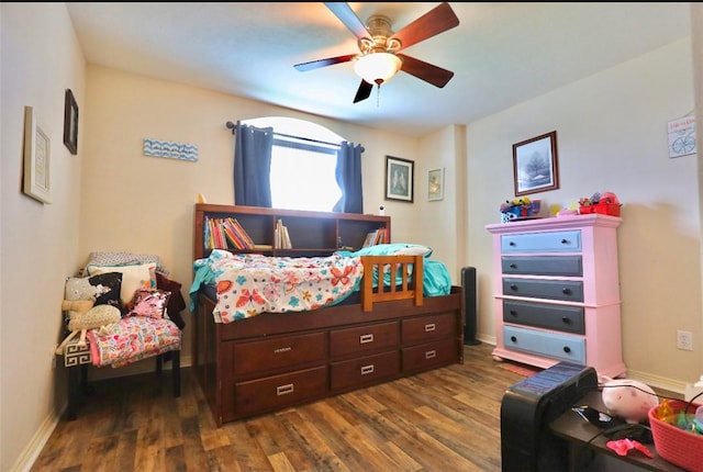2401 Woodbend Dr, Bryan, TX 77803 - bedroom with dark wood finished floors and ceiling fan
