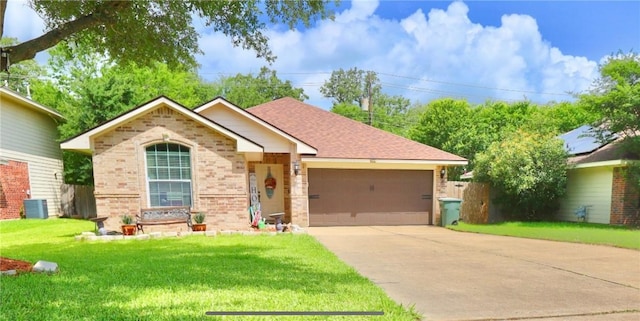 2401 Woodbend Dr, Bryan, TX 77803 - single story home with brick siding, an attached garage, driveway, a front lawn, and roof with shingles