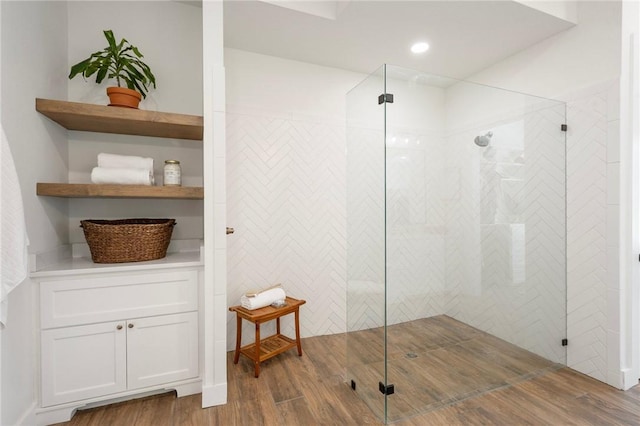 6038 Rain Meadow Dr, College Station, TX 77845 - bathroom featuring wood finished floors and a walk in shower