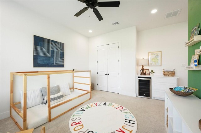 6038 Rain Meadow Dr, College Station, TX 77845 - bedroom with wine cooler, light colored carpet, recessed lighting, a closet, and a ceiling fan