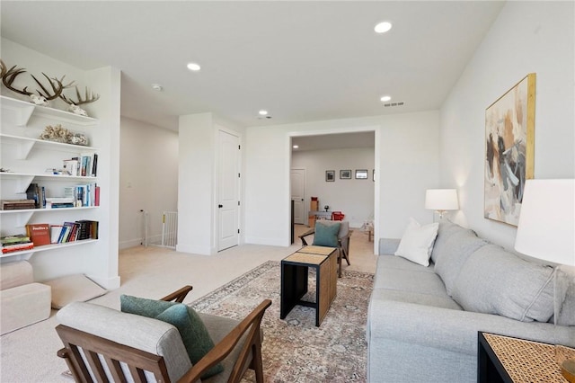 6038 Rain Meadow Dr, College Station, TX 77845 - living room with recessed lighting and light carpet