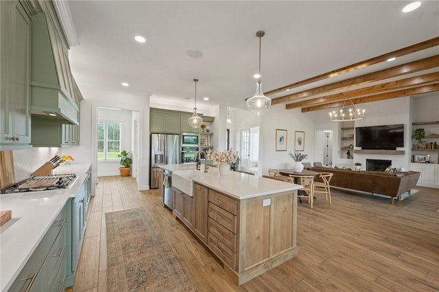6038 Rain Meadow Dr, College Station, TX 77845 - kitchen featuring green cabinetry, a sink, recessed lighting, appliances with stainless steel finishes, and light wood-style floors