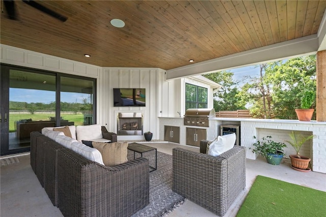6038 Rain Meadow Dr, College Station, TX 77845 - view of patio / terrace featuring an outdoor living space with a fireplace and wine cooler