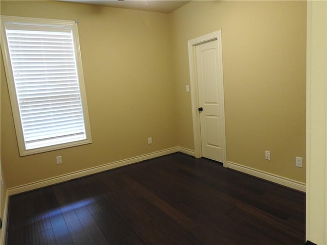 2622 Forest Oaks Dr, College Station, TX 77845 - spare room featuring dark wood finished floors and baseboards
