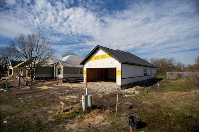 view of side of home featuring a garage