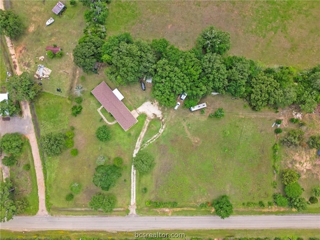 birds eye view of property with a rural view