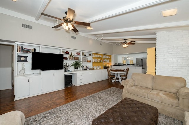 living room with dark hardwood / wood-style flooring, ceiling fan, lofted ceiling with beams, and built in desk