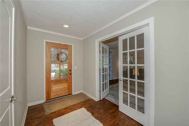 entryway featuring ornamental molding, dark wood-type flooring, french doors, and a textured ceiling