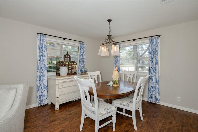 dining area with dark hardwood / wood-style floors