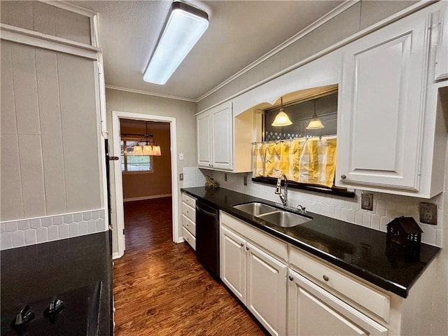 kitchen with sink, black dishwasher, white cabinetry, dark hardwood / wood-style floors, and decorative backsplash