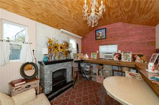 living area with wooden walls, a healthy amount of sunlight, and wood ceiling