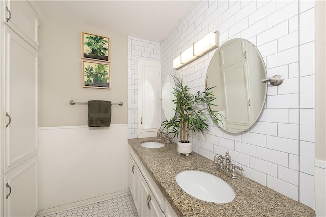 bathroom featuring tile walls and vanity