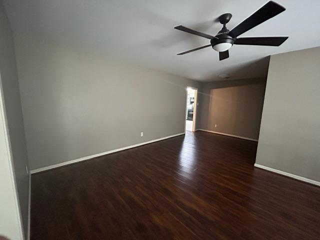4200 Milam St, Bryan, TX 77801 - empty room featuring wood finished floors, baseboards, and ceiling fan