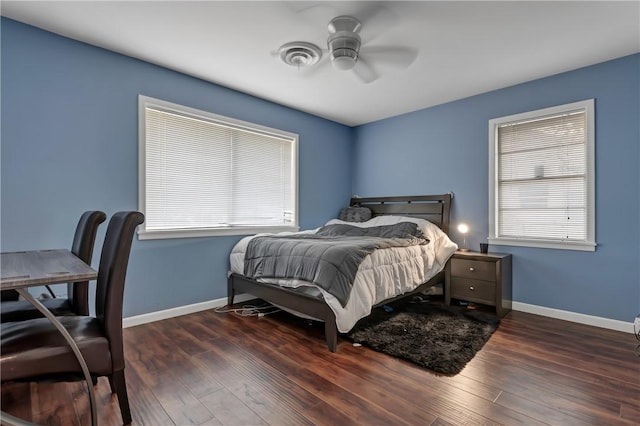 4200 Milam St, Bryan, TX 77801 - bedroom featuring wood finished floors, baseboards, and a ceiling fan