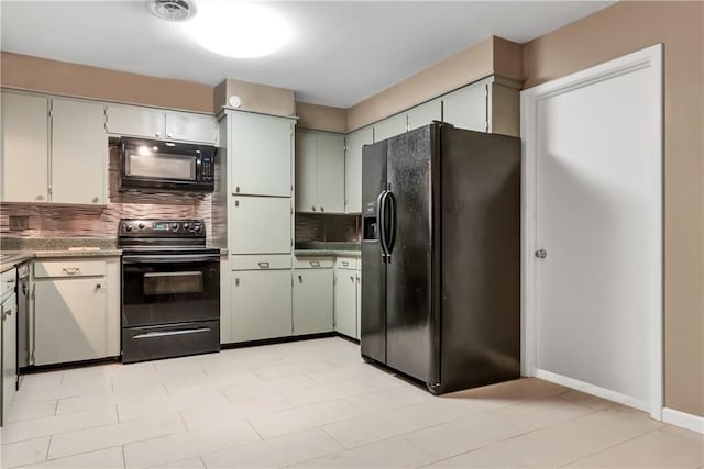 4200 Milam St, Bryan, TX 77801 - kitchen featuring black appliances, backsplash, and baseboards