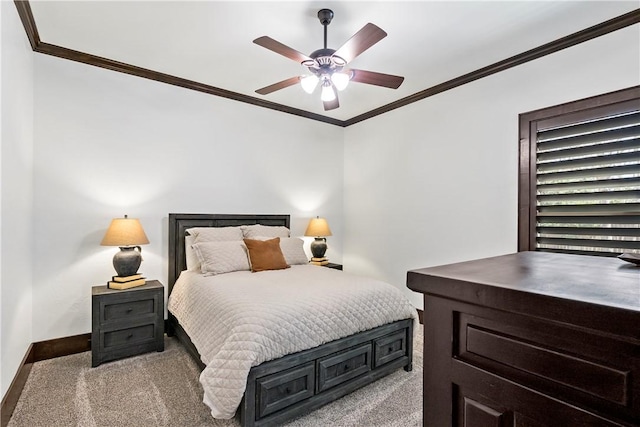 bedroom with ceiling fan, carpet flooring, baseboards, and ornamental molding