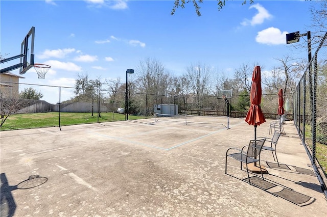 view of sport court featuring community basketball court and fence