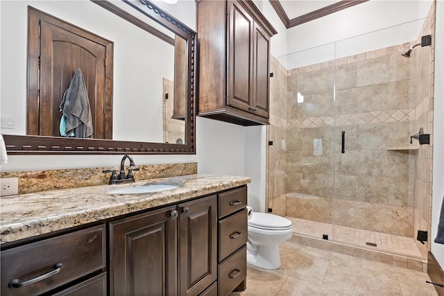 bathroom with vanity, a stall shower, tile patterned flooring, crown molding, and toilet