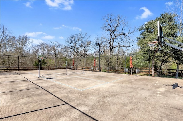 view of sport court with community basketball court, fence, and a tennis court