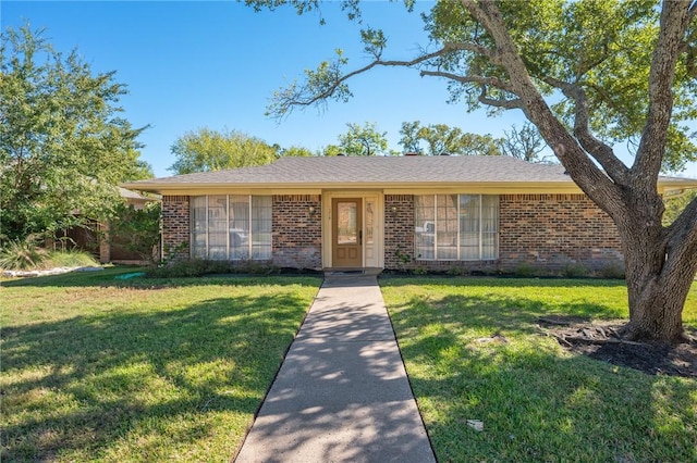 ranch-style house with a front lawn