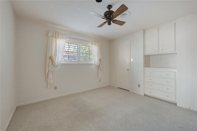 unfurnished bedroom with ceiling fan and light carpet