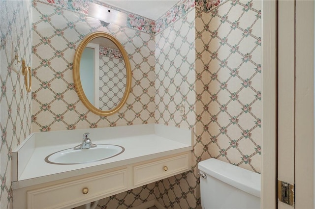 bathroom with vanity and toilet