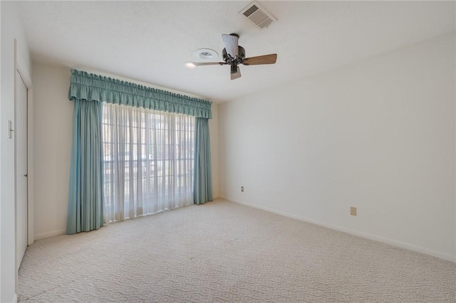 carpeted empty room with ceiling fan