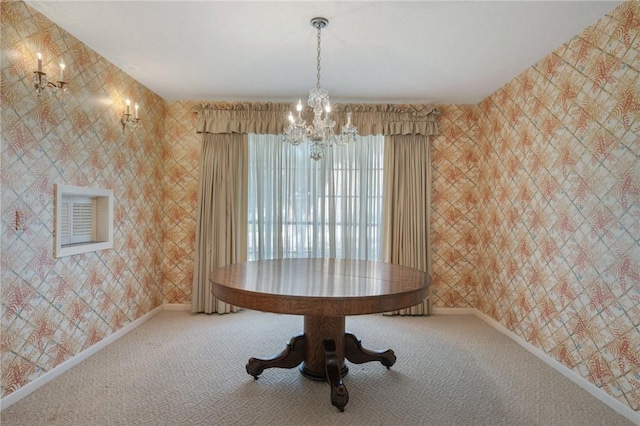 unfurnished dining area featuring carpet and a chandelier