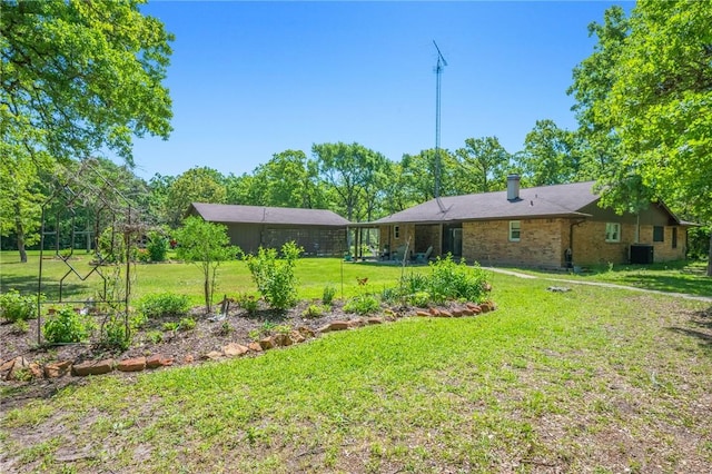 view of yard with central AC