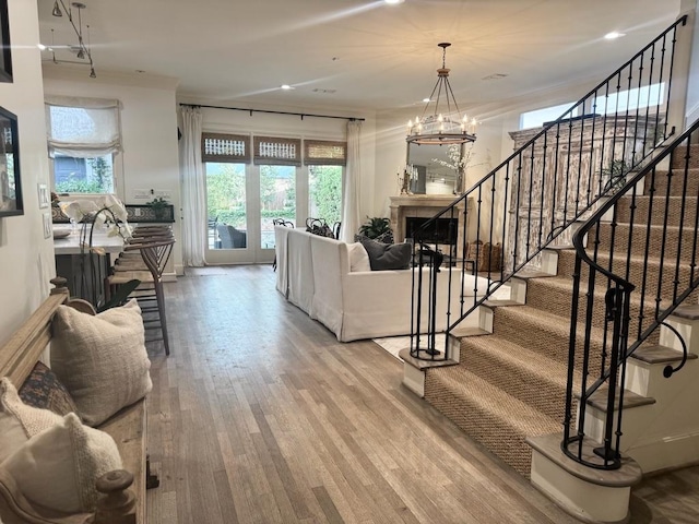 3911 Swarthmore St, Houston, TX 77005 - living area featuring wood finished floors, stairway, a chandelier, recessed lighting, and a fireplace