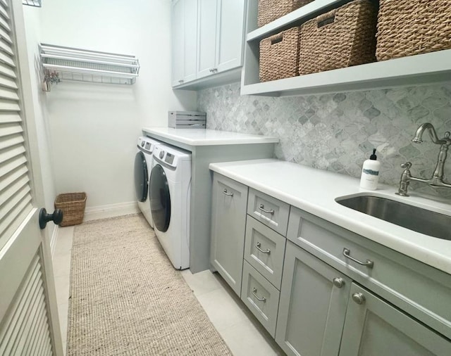 3911 Swarthmore St, Houston, TX 77005 - laundry room featuring cabinet space, washing machine and clothes dryer, light tile patterned floors, and baseboards