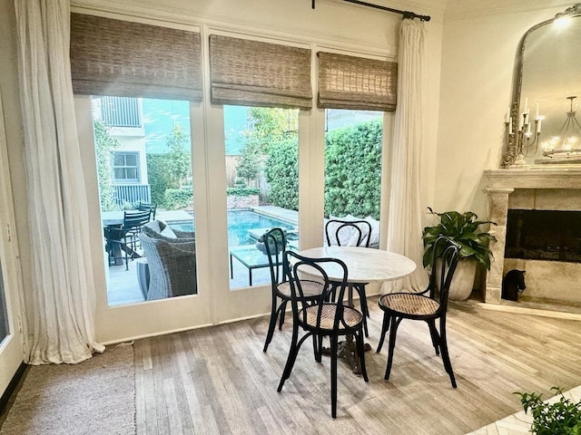 3911 Swarthmore St, Houston, TX 77005 - dining space featuring wood finished floors, healthy amount of natural light, and a fireplace