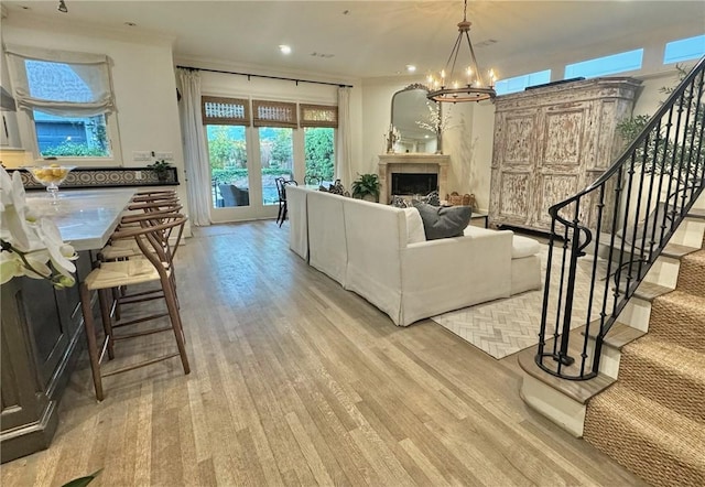 3911 Swarthmore St, Houston, TX 77005 - living area with a chandelier, stairs, light wood-style floors, recessed lighting, and a fireplace