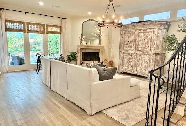 3911 Swarthmore St, Houston, TX 77005 - living area featuring a chandelier, light wood-style floors, crown molding, a fireplace, and recessed lighting
