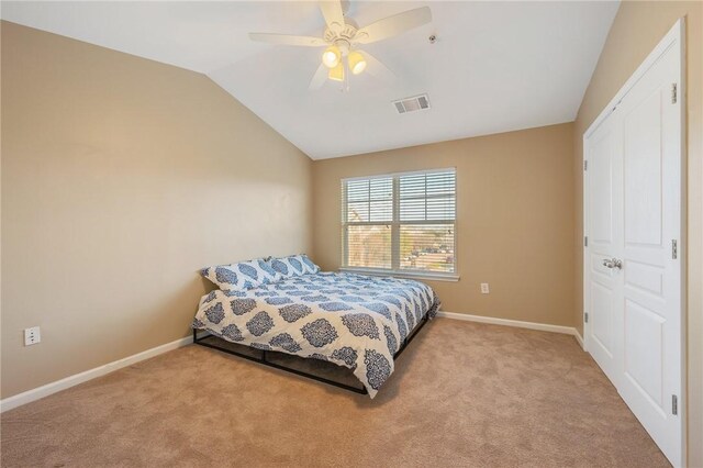 1725 Harvey Mitchell Pkwy, College Station, TX 77840 - bedroom featuring carpet flooring, visible vents, baseboards, ceiling fan, and vaulted ceiling