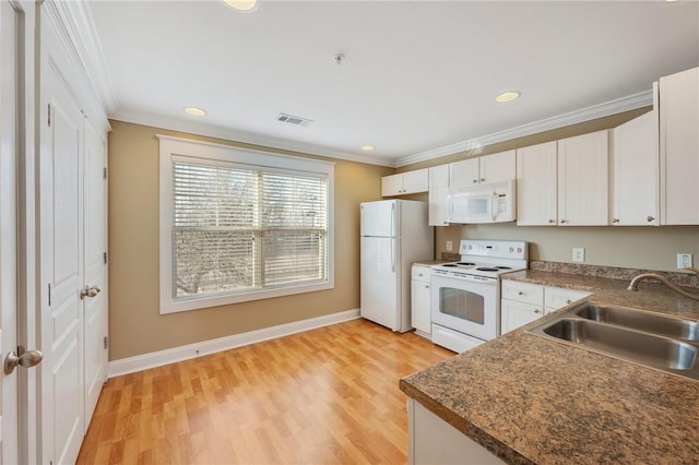1725 Harvey Mitchell Pkwy, College Station, TX 77840 - kitchen with ornamental molding, white appliances, light wood finished floors, and a sink