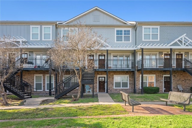 1725 Harvey Mitchell Pkwy, College Station, TX 77840 - townhome / multi-family property with stairway and brick siding