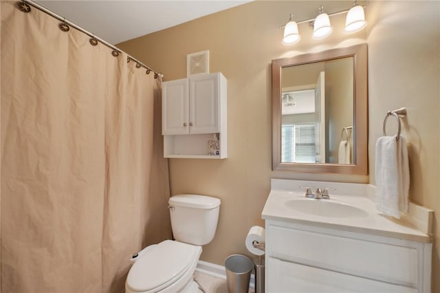 1725 Harvey Mitchell Pkwy, College Station, TX 77840 - full bathroom featuring toilet, visible vents, baseboards, and vanity