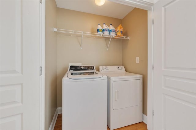 1725 Harvey Mitchell Pkwy, College Station, TX 77840 - washroom featuring laundry area, separate washer and dryer, and light wood-type flooring