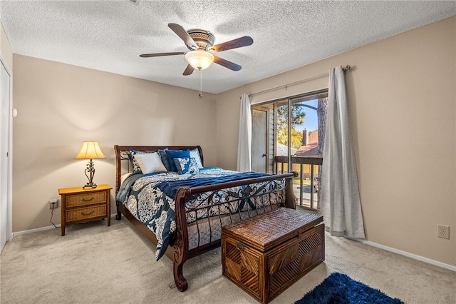 carpeted bedroom with access to exterior, ceiling fan, and a textured ceiling