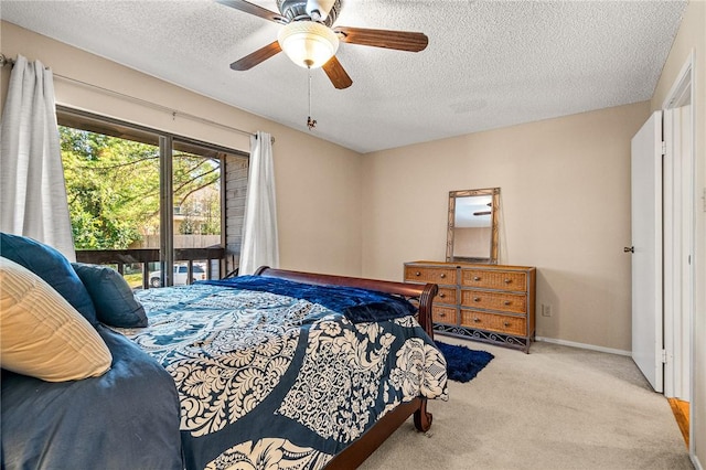 carpeted bedroom with access to exterior, ceiling fan, and a textured ceiling