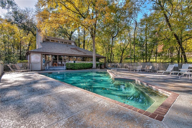 view of swimming pool with a patio area