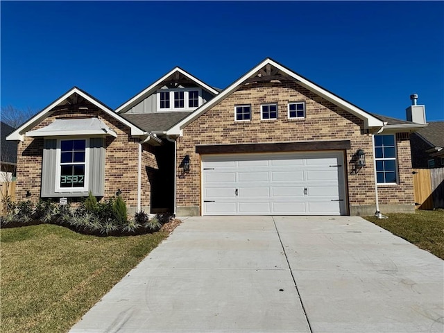 view of front facade with a garage and a front yard