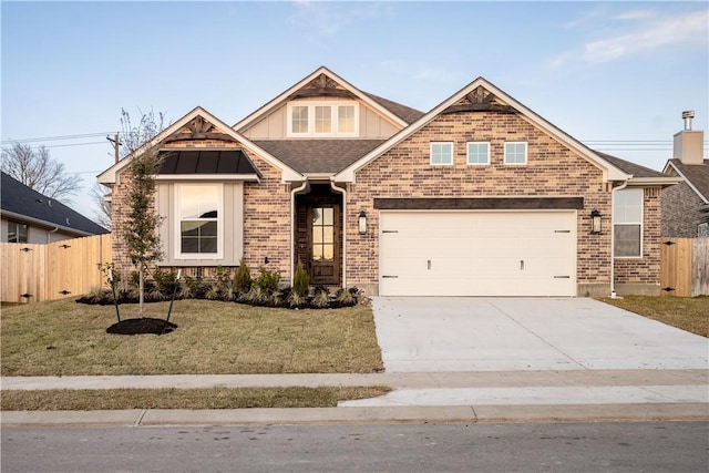 view of front facade featuring a garage and a front lawn