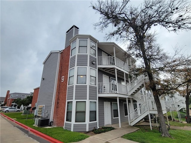 view of building exterior with central AC