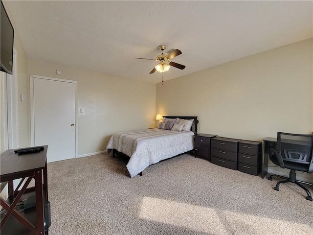 bedroom with ceiling fan and carpet flooring