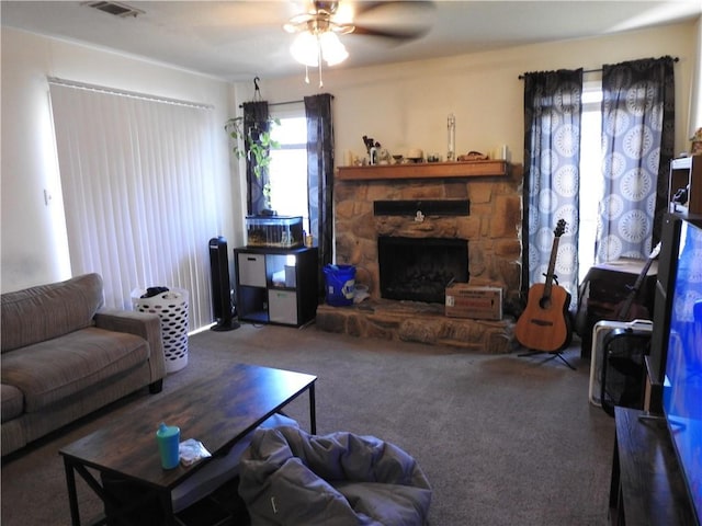 living room featuring ceiling fan, carpet flooring, and a fireplace