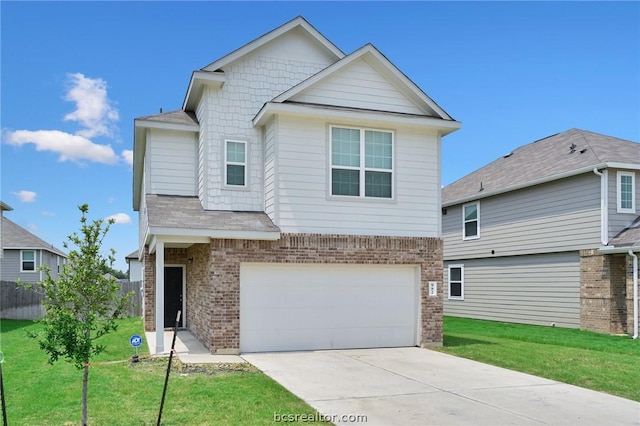 view of front of house featuring a front yard and a garage