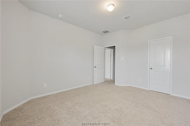 spare room featuring carpet floors